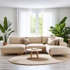 Sala de estar acogedora y natural con plantas y sofá beige.
